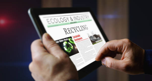 istock Recycling environment and ecology newspaper on mobile tablet screen 1566859825