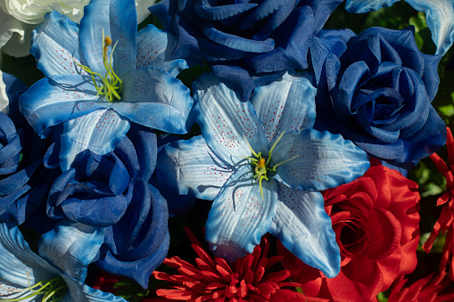 Blue flowers. Artificial flowers. Bouquet of petals. Summer plant.