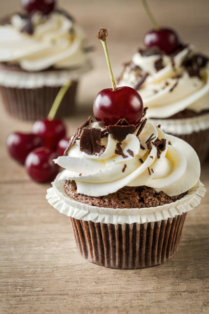 istock cupcake with vanilla cream and cherry 1566869618