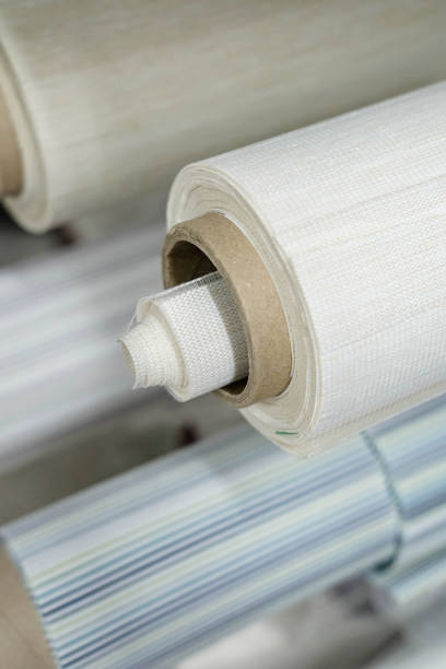 istock Rolls of fabric for roller blinds are in production 1566879450