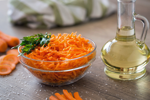 Diet and healthy salad fresh grated carrot and oil