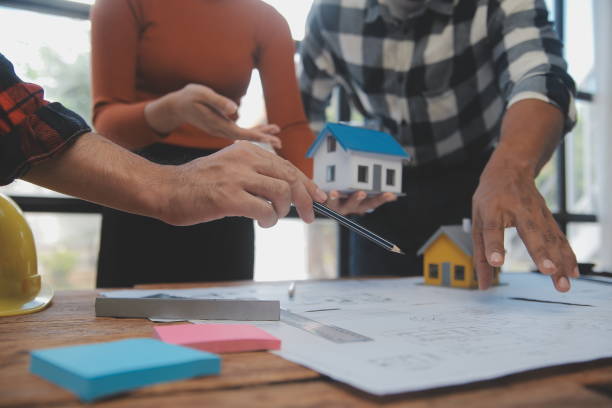 istock Engineer Teamwork Meeting, Drawing working on blueprint meeting for project working with partner on model building and engineering tools in working site, Construction and structure concept. 1566896295