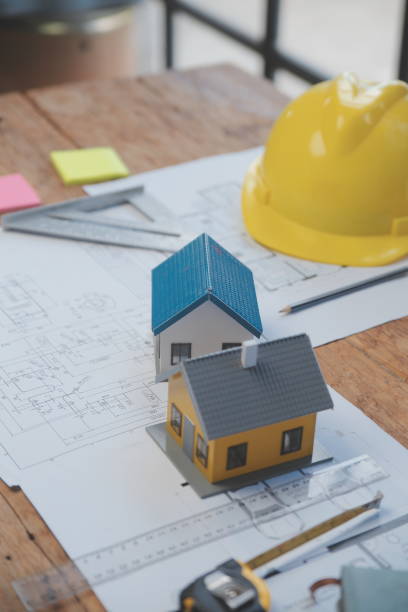 istock Engineer Teamwork Meeting, Drawing working on blueprint meeting for project working with partner on model building and engineering tools in working site, Construction and structure concept. 1566896896