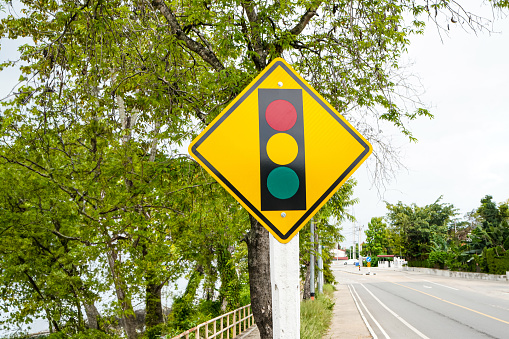 The image shows a traffic light warning the car that a traffic light is coming at the intersection ahead.