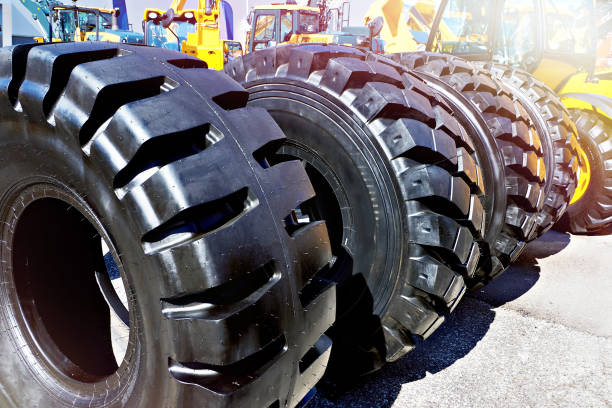 istock Rubber tire black on construction transport 1566920081