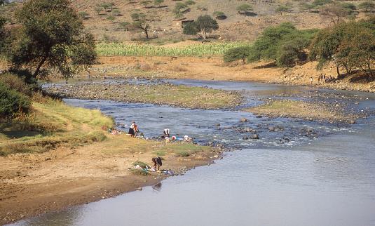 Zulu women washing clothing in the Mooi River at Keate's Drift in the KwaZulu-Natal province of South Africa.