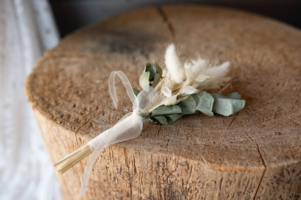 istock Groom boutonniere in boho style 1566941590