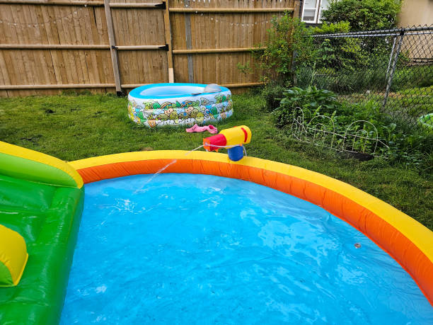 istock Water Gun on Kids Pool 1566951848