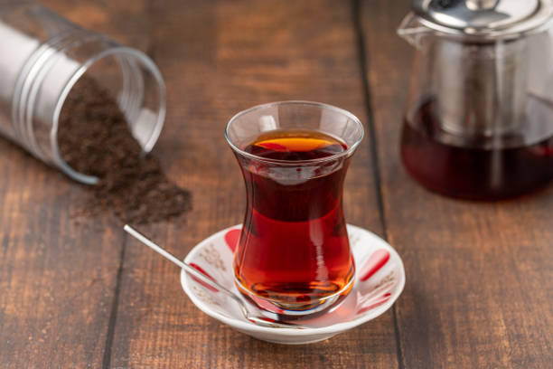 istock Freshly brewed turkish tea in thin-waisted glass cup on wooden table 1566957964