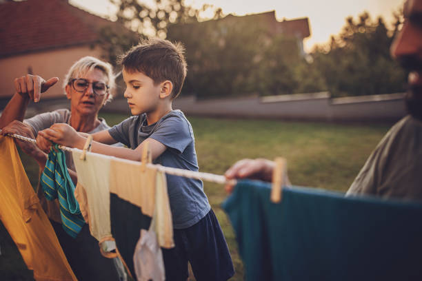 Family hanging laundry stock photo