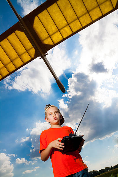 istock Little boy playing with airplane 156700467