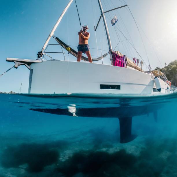 istock Man fishing on a boat 1567004948