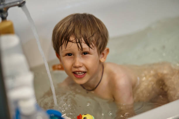 istock Child having fun while bathing in the bathroom 1567008350