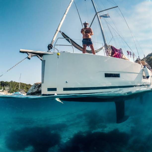 istock Man fishing on a boat 1567026290