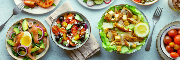istock Fresh salads panorama, overhead flat lay shot of an assortment 1567061003