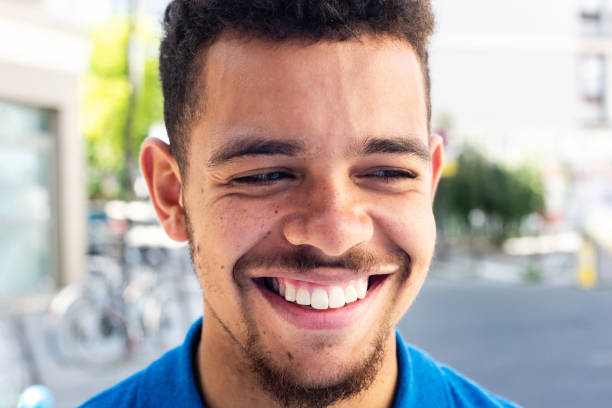 istock Close up mixed race african American young man smiling 1567081036