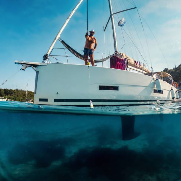 istock Man fishing on a boat 1567087834