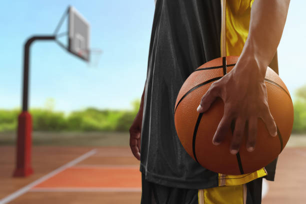 istock Basketball male player holding a ball 1567098855