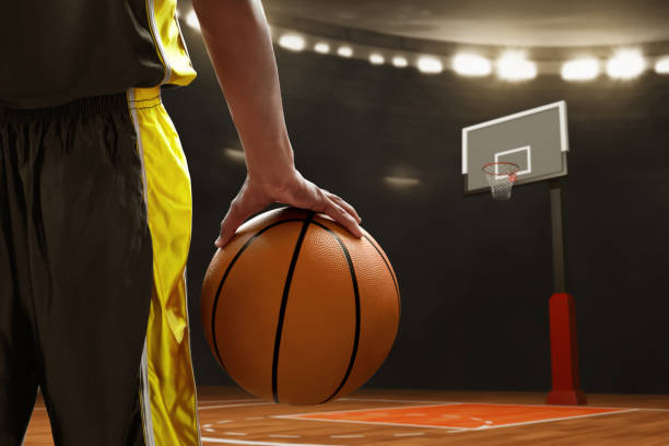 istock Basketball male player holding a ball 1567098858