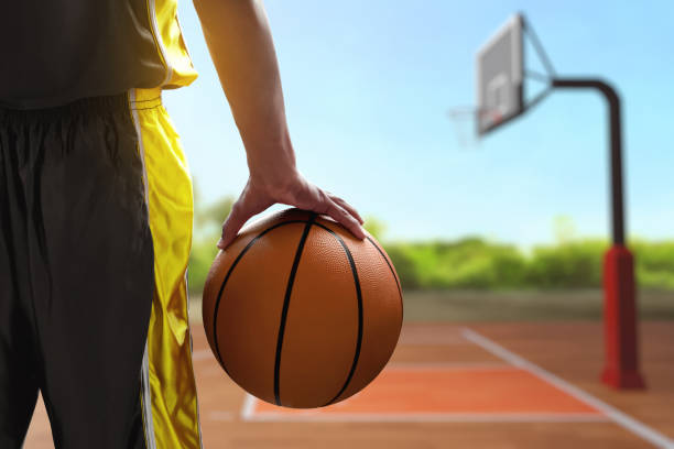 istock Basketball male player holding a ball 1567099392