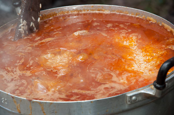 istock boiling rice with buried goat meat in pot 156710058