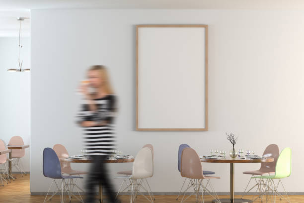 istock Cafe or restaurant interior with blank poster on the wall 1567102079