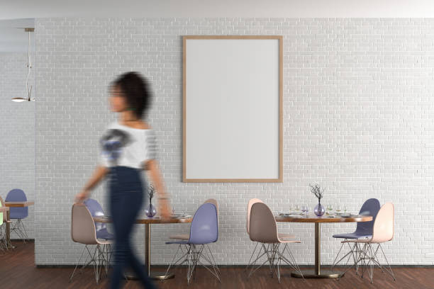 istock Cafe or restaurant interior with blank poster on the wall 1567102096