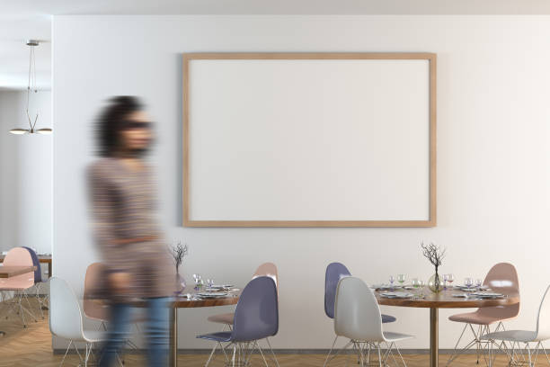 istock Cafe or restaurant interior with blank poster on the wall 1567102622