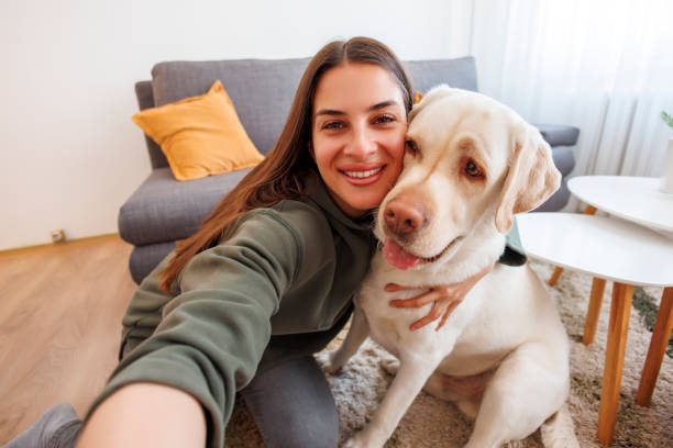 istock Woman taking a selfie with her dog 1567103897