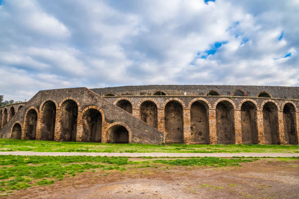 Main entrance of Amphitheatre of Pompeii Main entrance facade of Amphitheatre of Pompeii pompeii ruins stock pictures, royalty-free photos & images