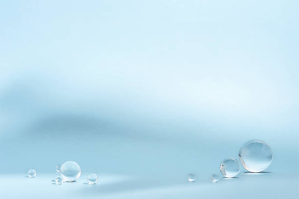 istock Blue background with transparent glass balls. 1567117572