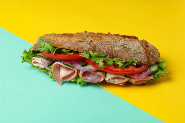 istock Tasty ciabatta sandwich on two tone background 1567141954