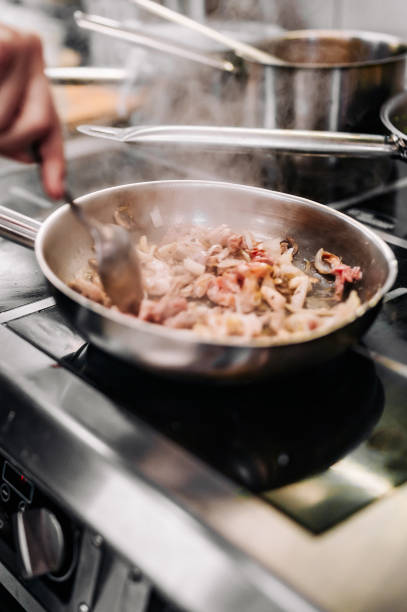 istock Chef cook hand cooking food at the restaurant kitchen 1567145718
