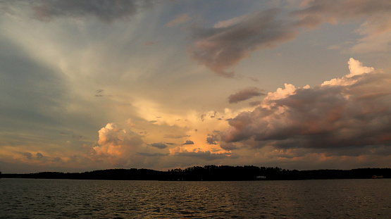 Some cloudy evening skies shot above beautiful Lake Sinclair in Milledgeville, Georgia.