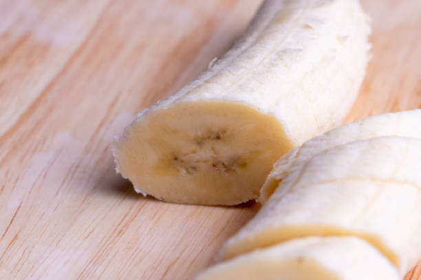 istock Sliced ripe banana on a cutting board 1567160078