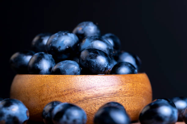 istock Blue grapes grown in a home vineyard 1567160101