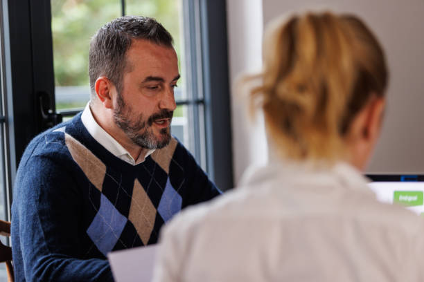 istock Business colleagues discussing ideas when co-working on a project 1567166756