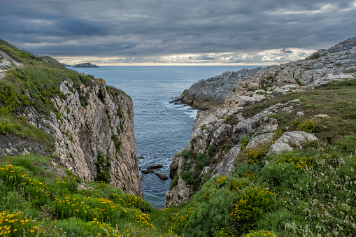 Steep cliffs in the island of Virgen del Mar, Costa Quebrada, Cantabria, Spain
