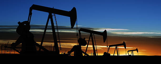 istock XXXL pumpjack silhouettes 156716823