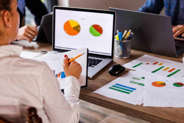 istock Businesswoman reviewing a clipboard with project result documents 1567169518