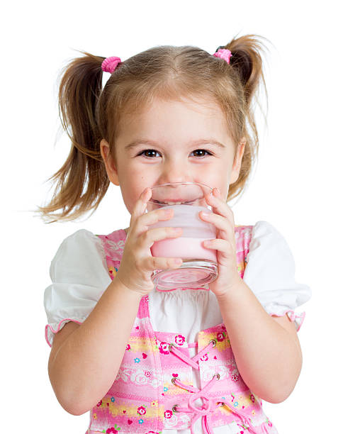 istock Kid girl drinking yoghurt from glass 156717137