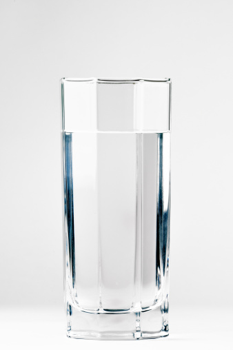 With a glass of water on a white background