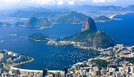 Panoramic view of Rio de Janeiro City from Corcovado hill. View of Guanabara Bay, the sugarloaf, and the Botafogo neighborhood.