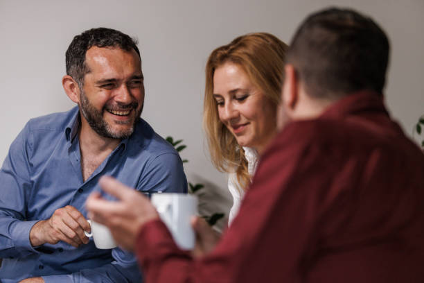 istock Three business colleagues having coffee break together 1567175122