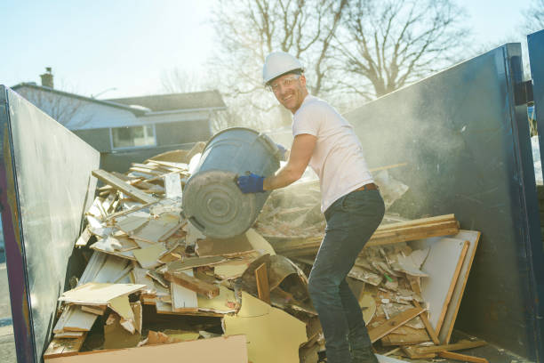 istock Construction Worker outside of house put old renovation material on big conteiner 1567175149