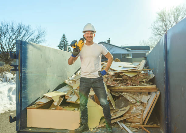 istock Construction Worker outside of house put old renovation material on big conteiner 1567175164