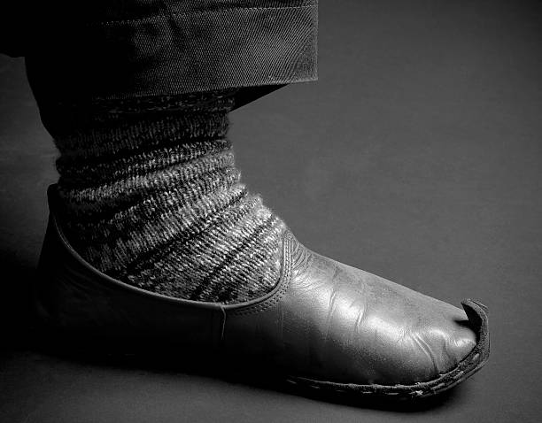 istock Old style sock and shoe. 156717906
