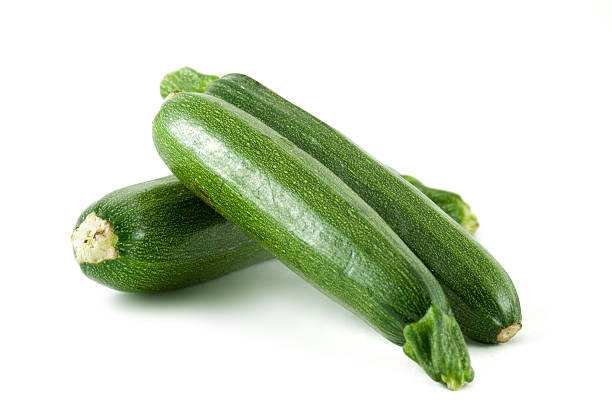 Zucchini Courgettes isolated on white courgette stock pictures, royalty-free photos & images