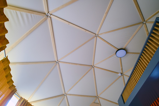 The ceiling in a round house in the form of a geodesic dome