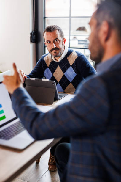 istock Business associates discussing strategies when collaborating on a mutual project 1567218403